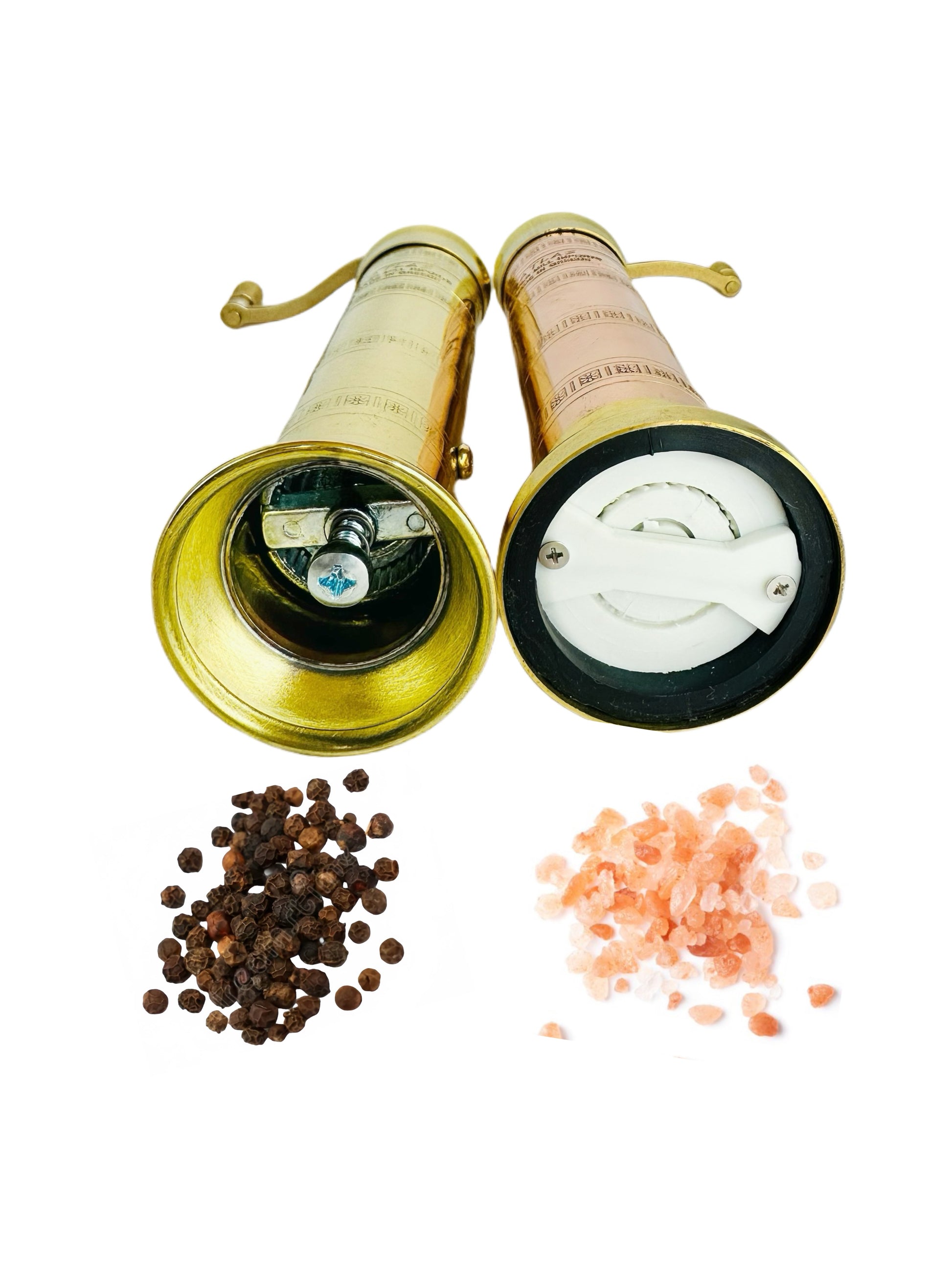 Combo grinders with peppercorns and salt on a white background