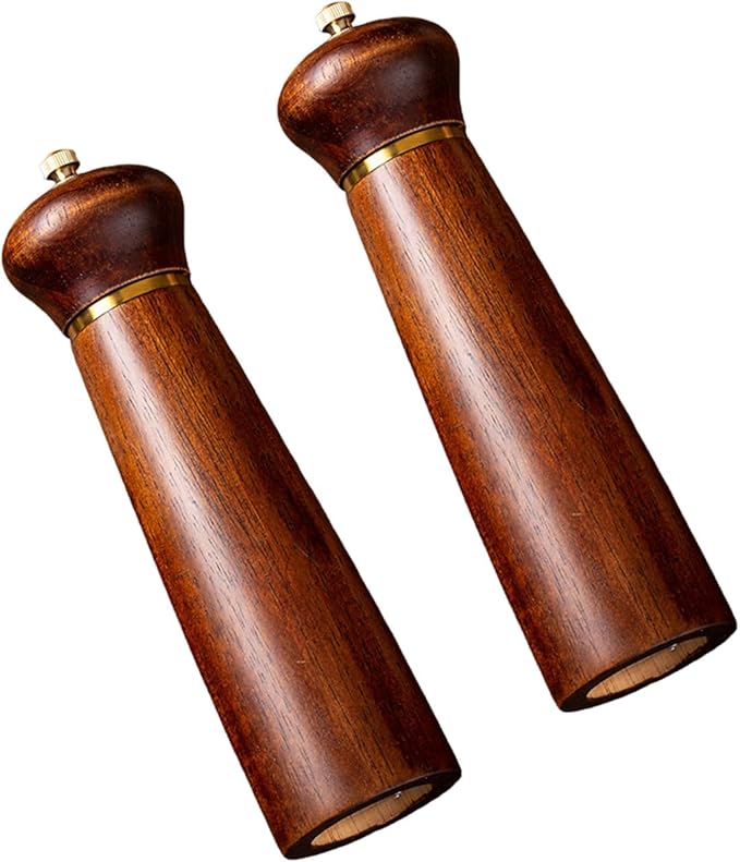 Pair of wooden pepper mills on a white background