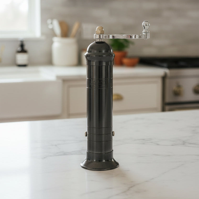 Black pepper grinder on a white background