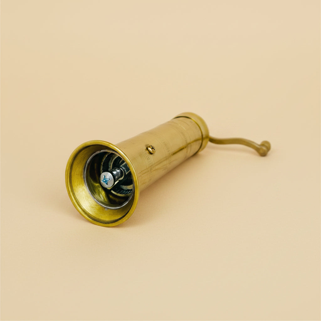 Vintage-style wooden kitchen pepper and salt grinder on a white background