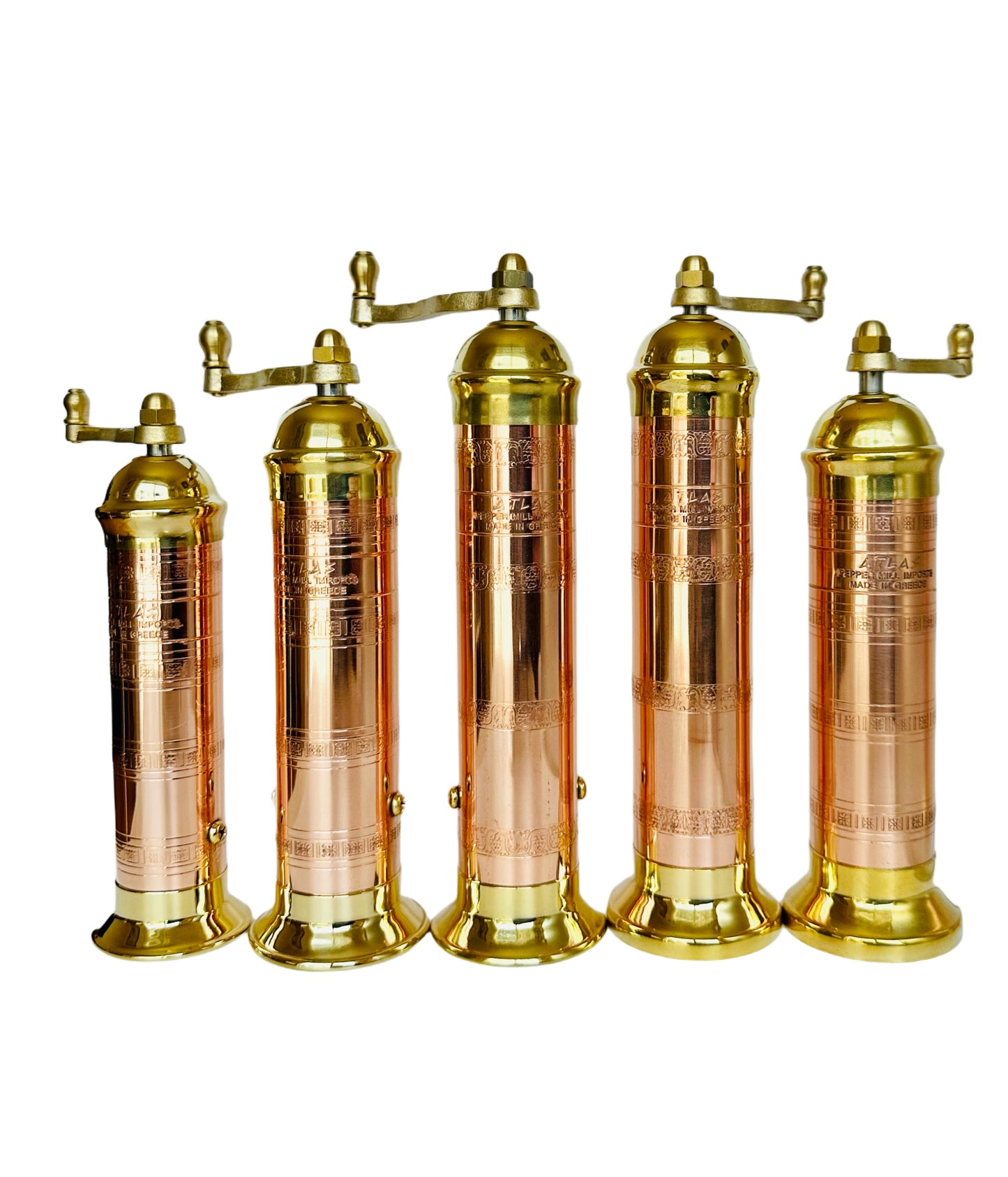 Set of five brass and copper canisters on a white background