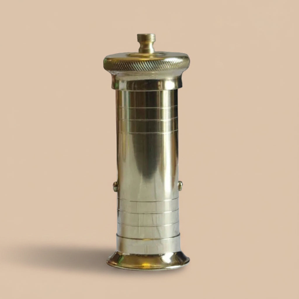 Brass Atlas Chef pepper mill with rotating top, used in Michelin-starred restaurants for precise grinding, available from Peppermill Imports.