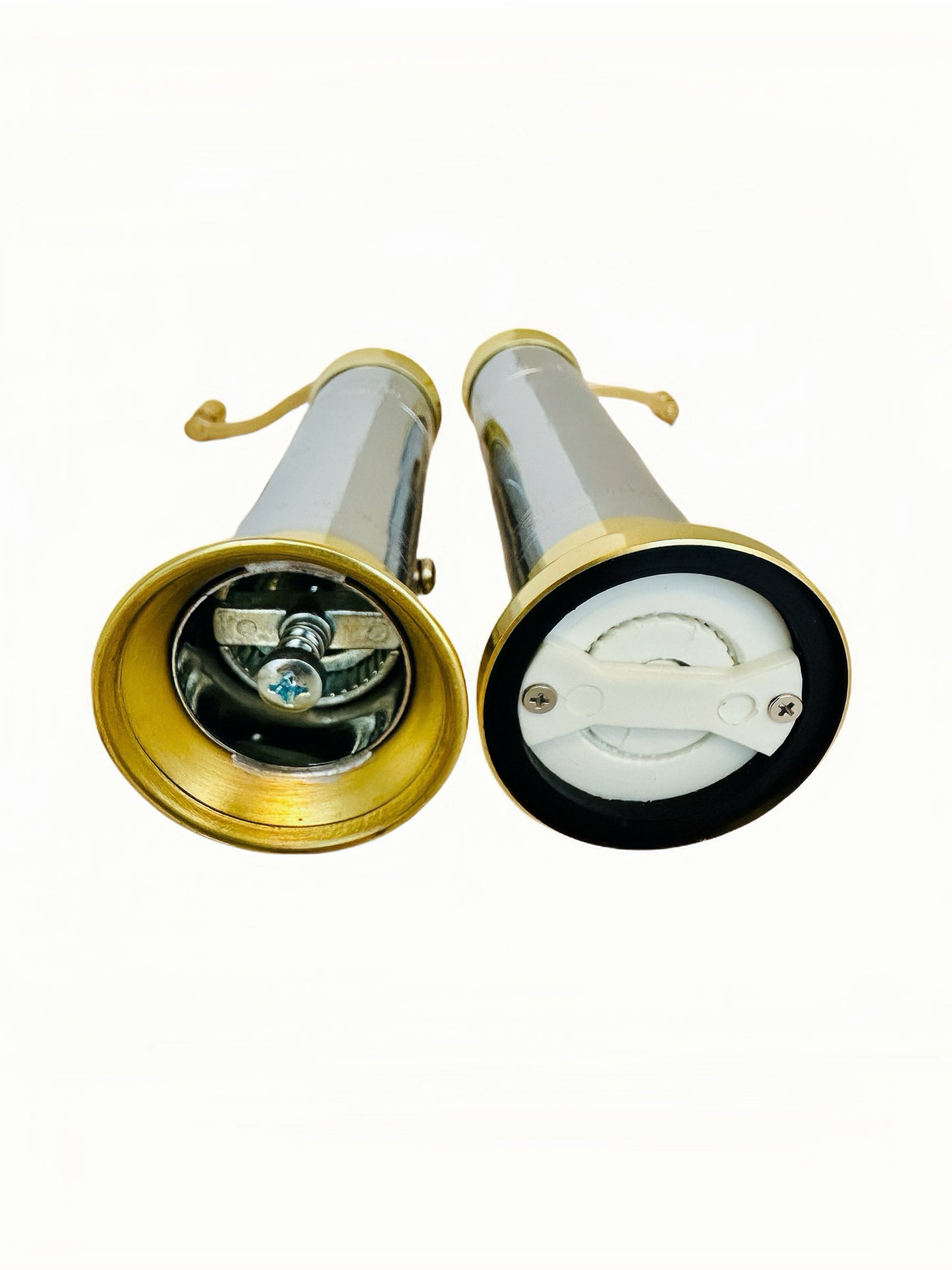 chrome-brass pepper/salt mill set on a white background