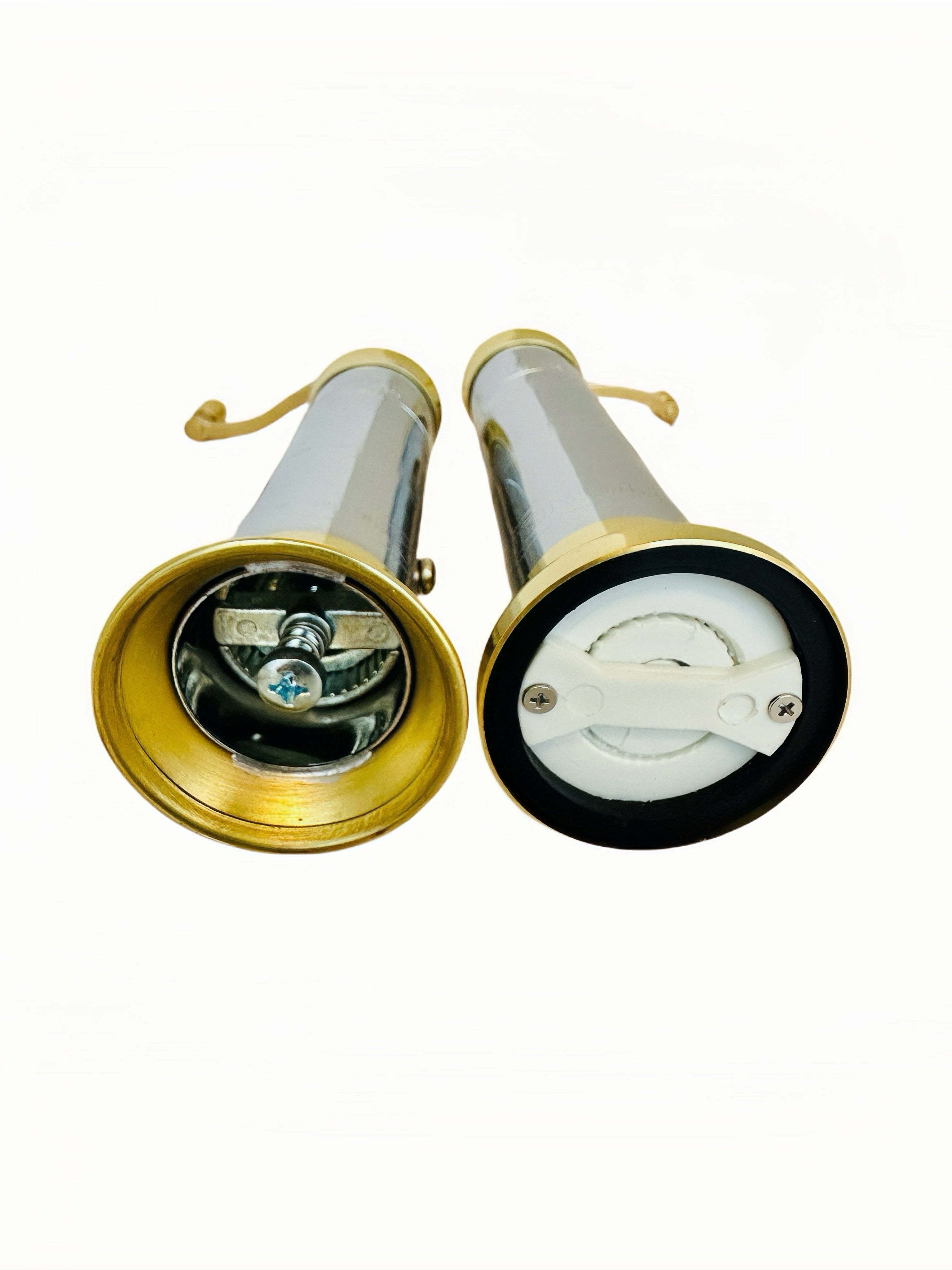 chrome-brass pepper/salt mill set on a white background