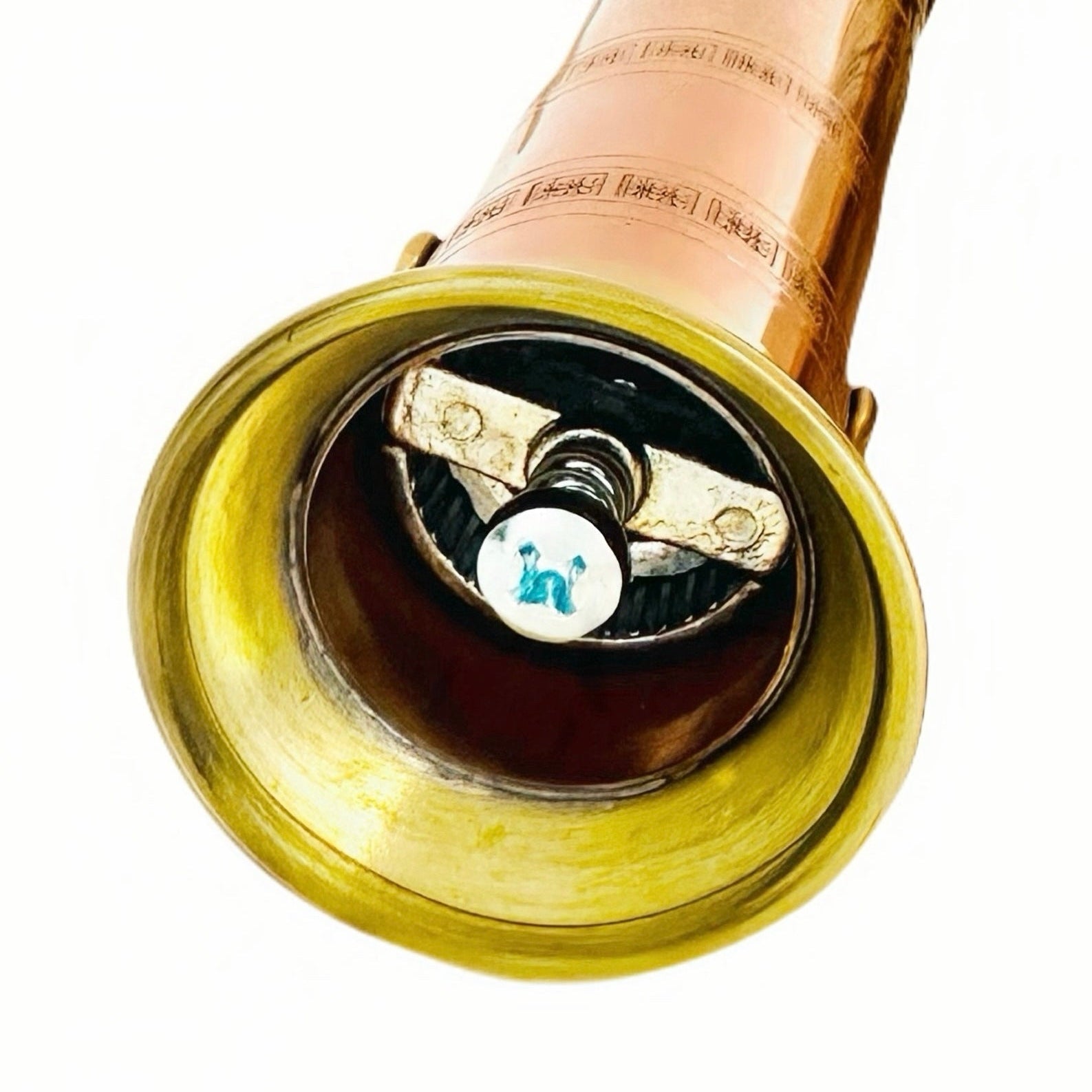 Close-up of a vintage-style brass horn with intricate details on a white background