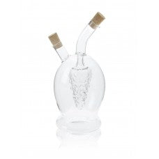 Clear glass bottle with cork stopper on a white background