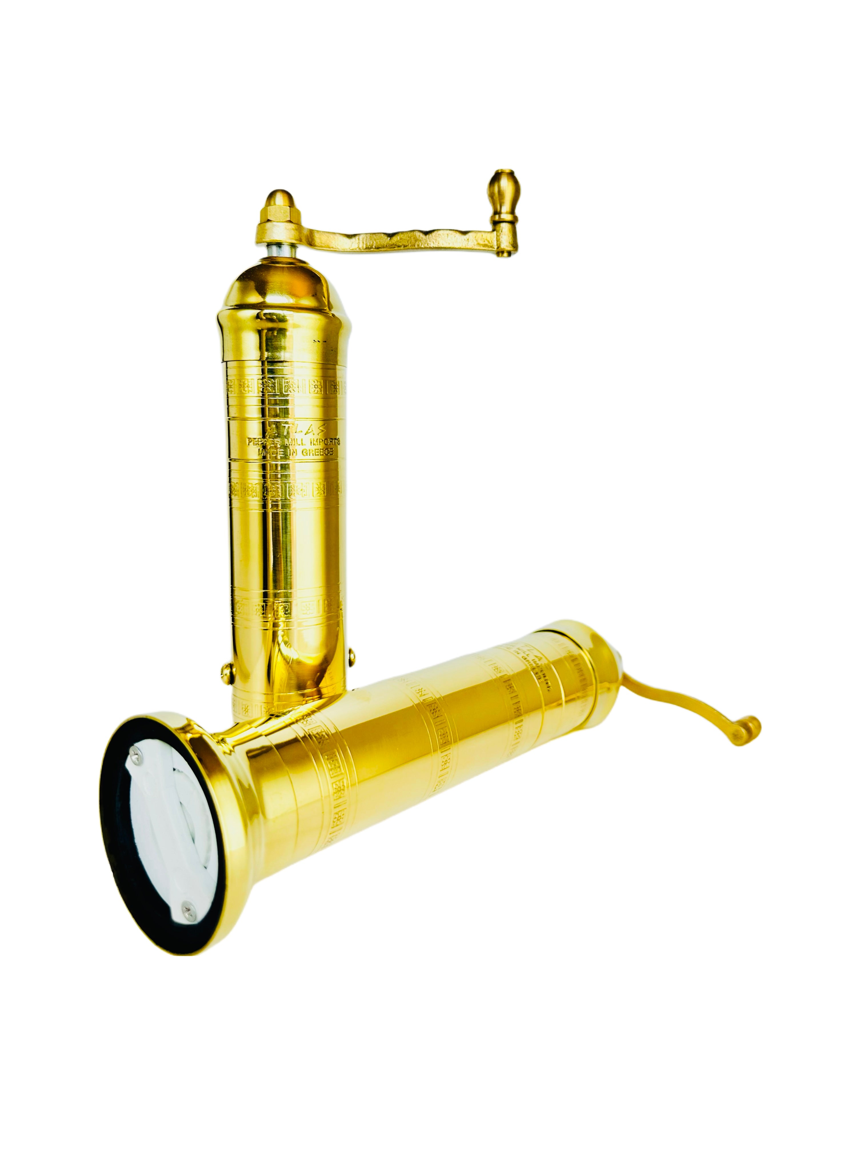 Gold pepper grinder on white background