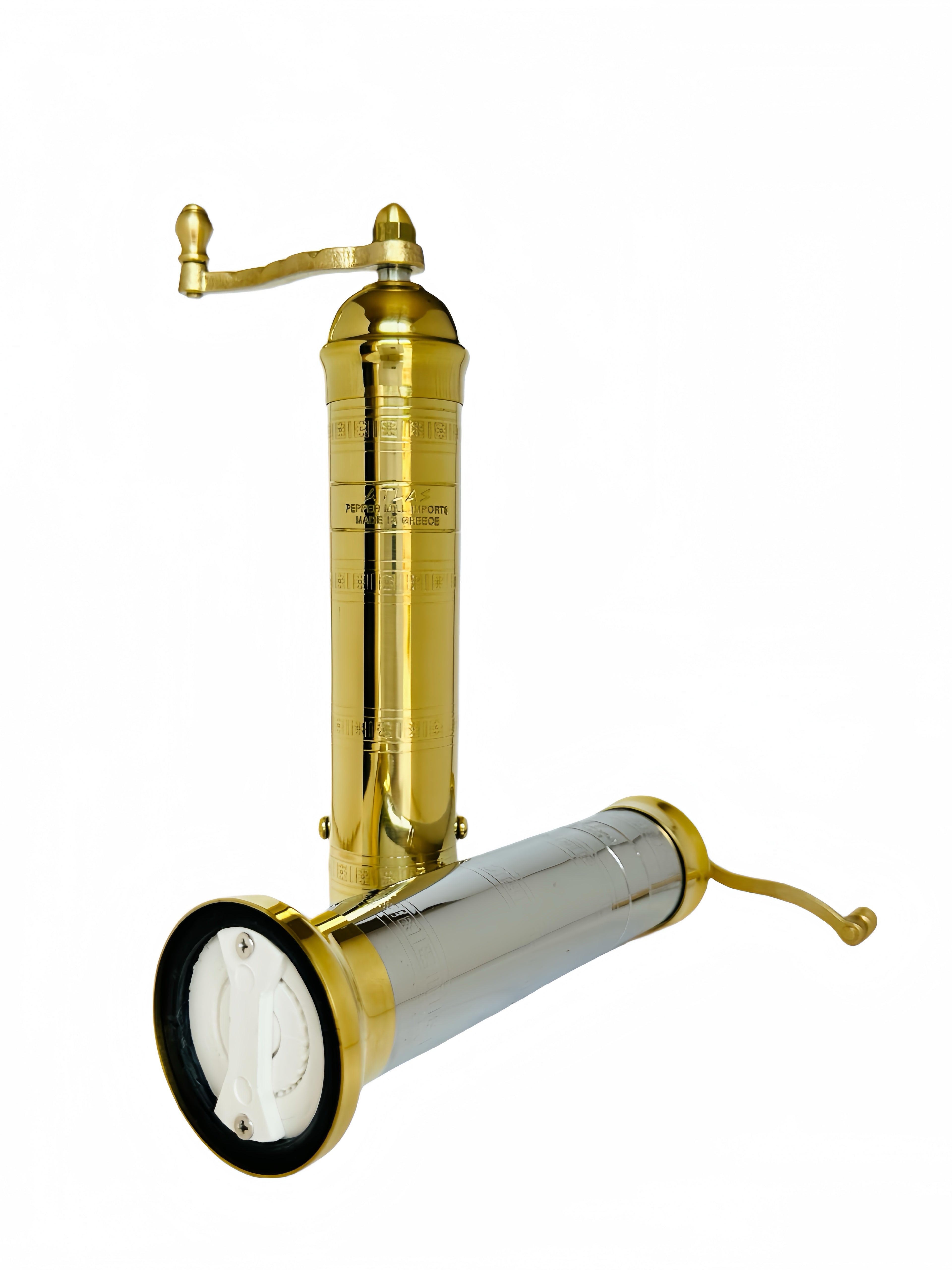 Gold and silver manual pepper/salt grinder on a white background