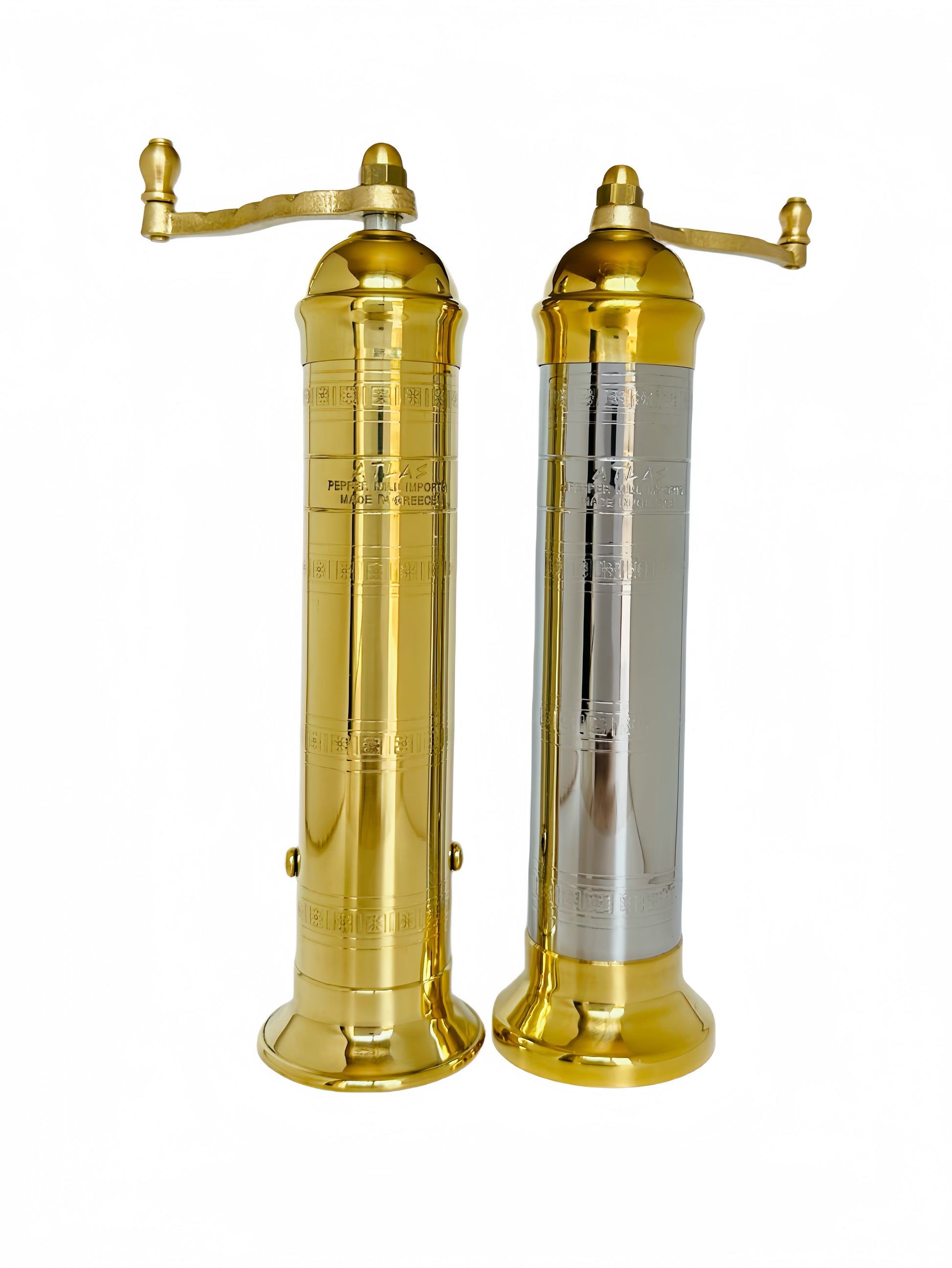 Set of pepper and salt grinders, one gold and one silver, on a white background